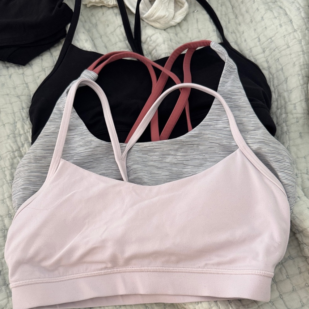 Three lululemon sports bras. All size medium, grey does not have padding!